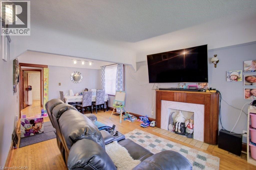34 Barons Avenue S, Hamilton, ON - Indoor Photo Showing Living Room With Fireplace