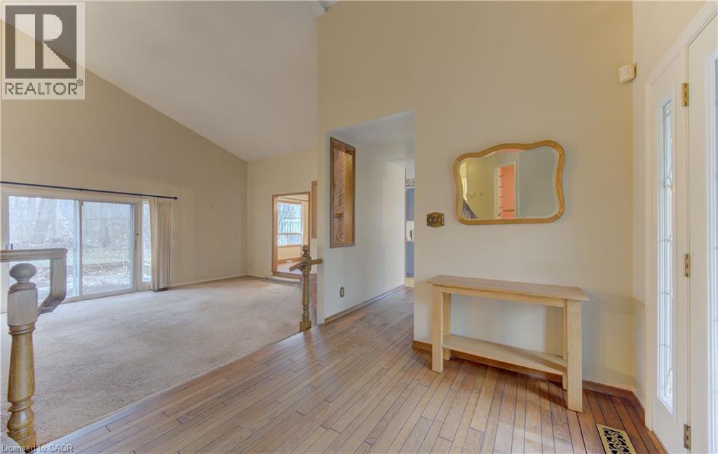 Entrance foyer featuring light wood-style flooring, light colored carpet, and vaulted ceiling - 190 Silvercrest Drive, Waterloo, ON - Indoor Photo Showing Other Room