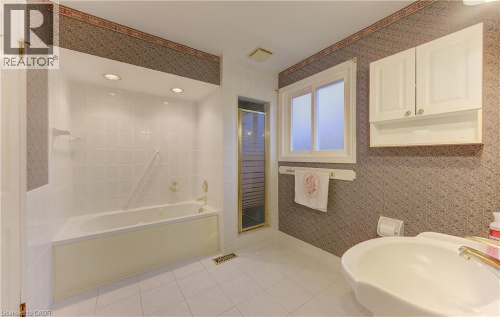 Bathroom featuring wallpapered walls, a bath, a shower stall, and light tile patterned floors - 190 Silvercrest Drive, Waterloo, ON - Indoor Photo Showing Bathroom