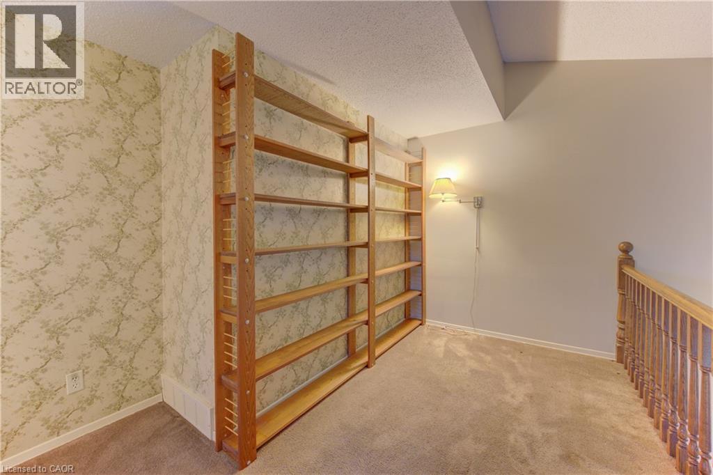 Hallway with a textured ceiling, light carpet, and wallpapered walls - 190 Silvercrest Drive, Waterloo, ON - Indoor Photo Showing Other Room