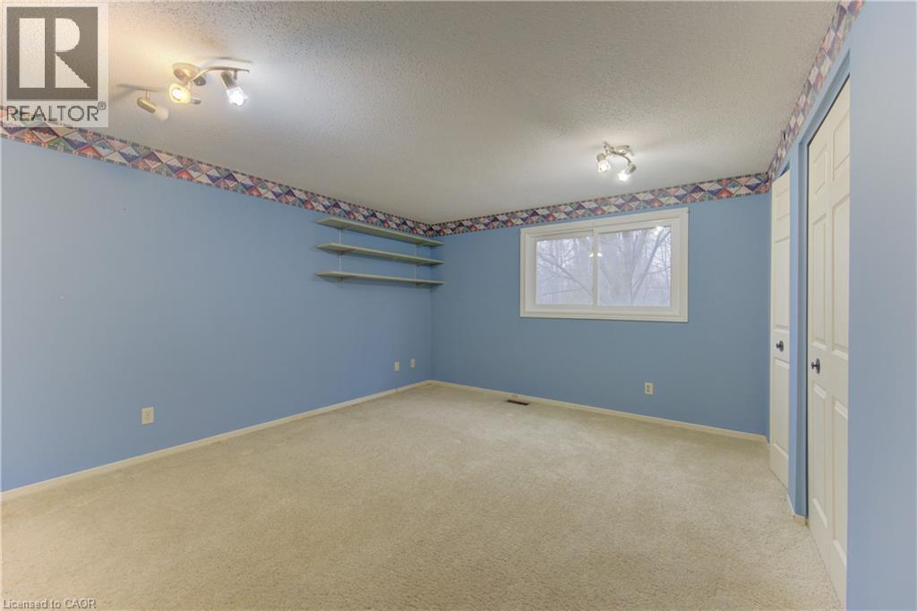 Empty room with light colored carpet and a textured ceiling - 190 Silvercrest Drive, Waterloo, ON - Indoor Photo Showing Other Room