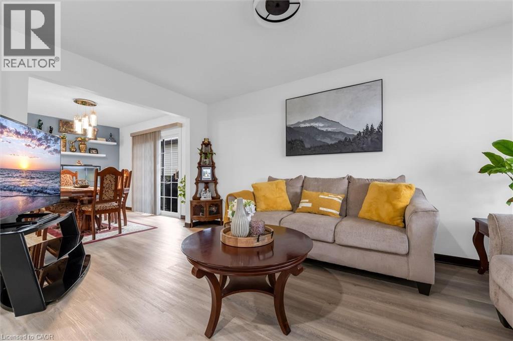 Living room featuring wood finished floors - 51 Independence Drive, Hamilton, ON - Indoor Photo Showing Living Room