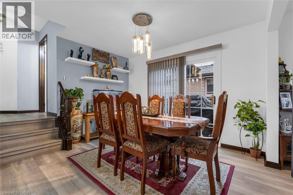 Dining room featuring light wood-style flooring and hanging lights - 51 Independence Drive, Hamilton, ON - Indoor Photo Showing Dining Room