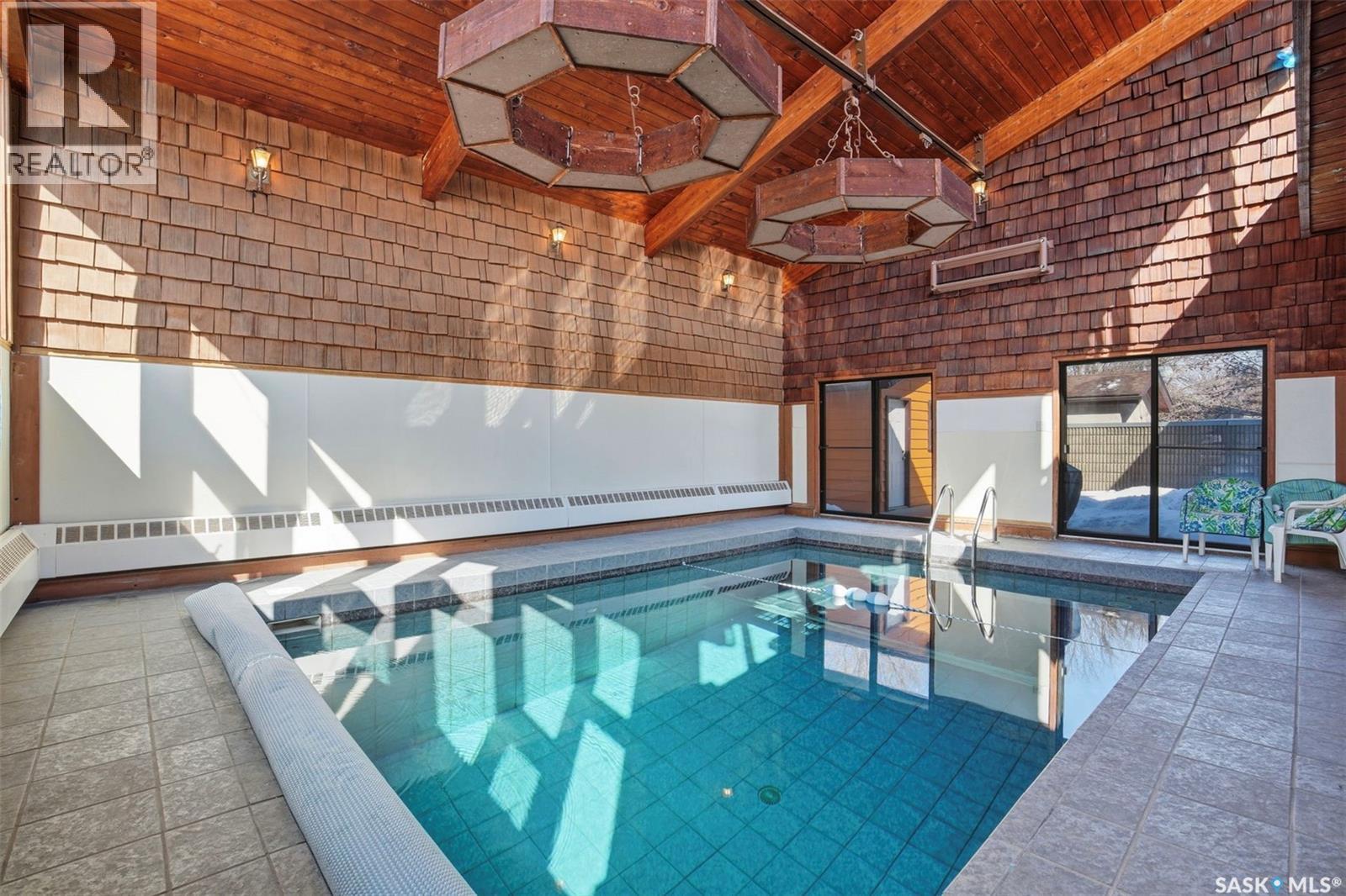 31 Cantlon Crescent, Saskatoon, SK - Indoor Photo Showing Other Room With In Ground Pool