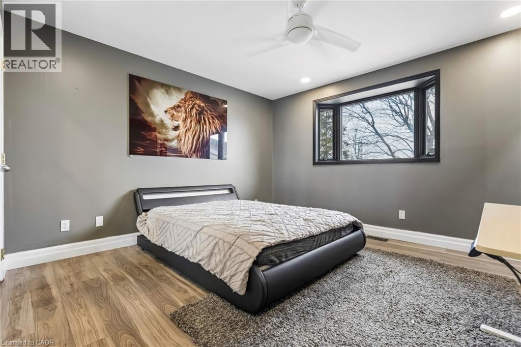 Bedroom featuring light wood-style floors, ceiling fan, and recessed lighting - 3 Chicopee Terrace, Kitchener, ON - Indoor Photo Showing Bedroom