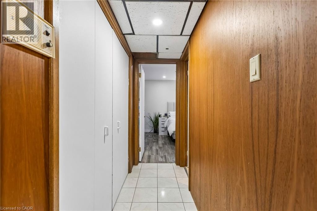Hallway with light tile patterned floors, recessed lighting, and a paneled ceiling - 3 Chicopee Terrace, Kitchener, ON - Indoor Photo Showing Other Room
