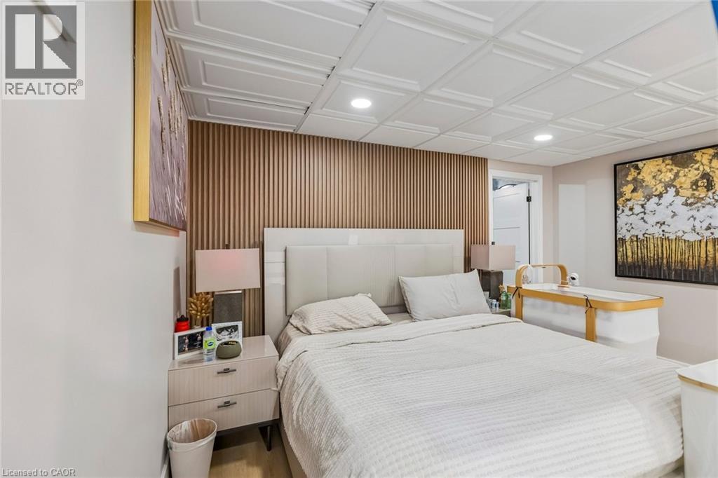 Bedroom with recessed lighting, wood finished floors, and wooden walls - 3 Chicopee Terrace, Kitchener, ON - Indoor Photo Showing Bedroom