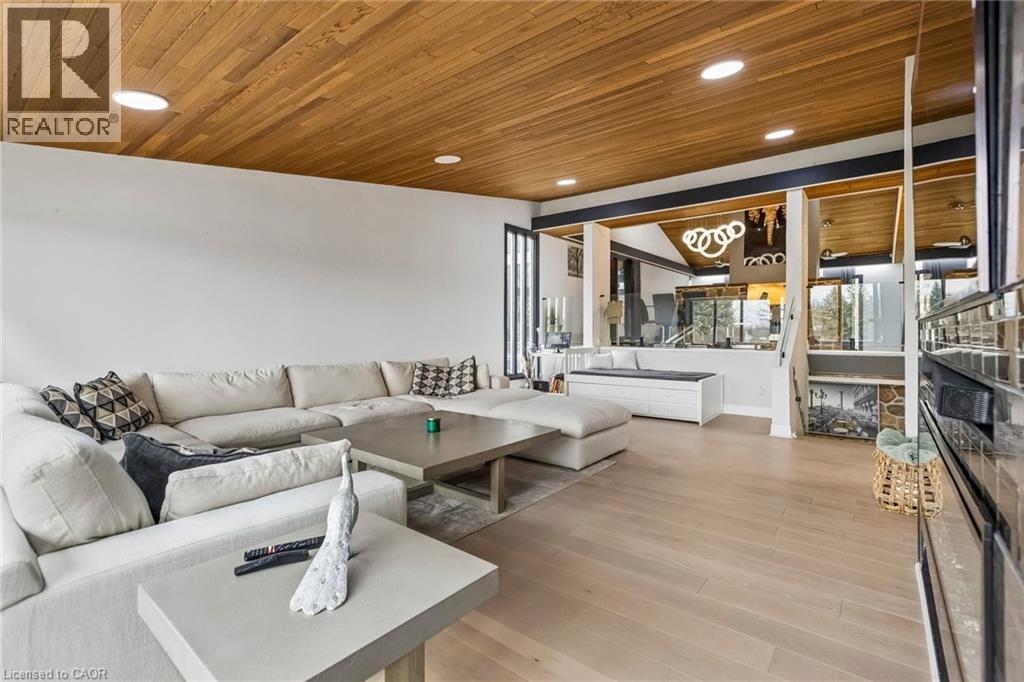 Living area featuring light wood-type flooring, a vaulted wood ceiling, and recessed lighting - 3 Chicopee Terrace, Kitchener, ON - Photo Showing Living Room