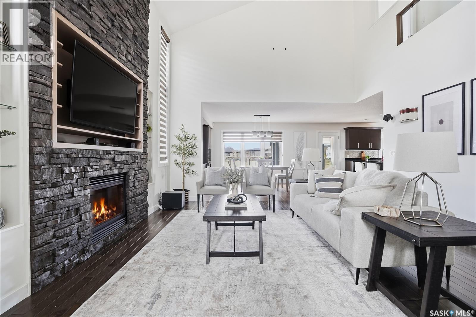4128 Green Willow Terrace E, Regina, SK - Indoor Photo Showing Living Room With Fireplace