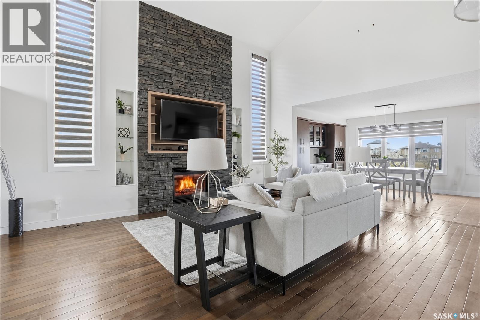 4128 Green Willow Terrace E, Regina, SK - Indoor Photo Showing Living Room With Fireplace