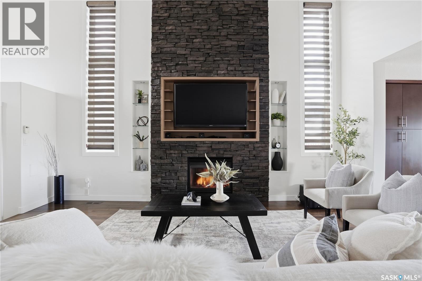 4128 Green Willow Terrace E, Regina, SK - Indoor Photo Showing Living Room With Fireplace