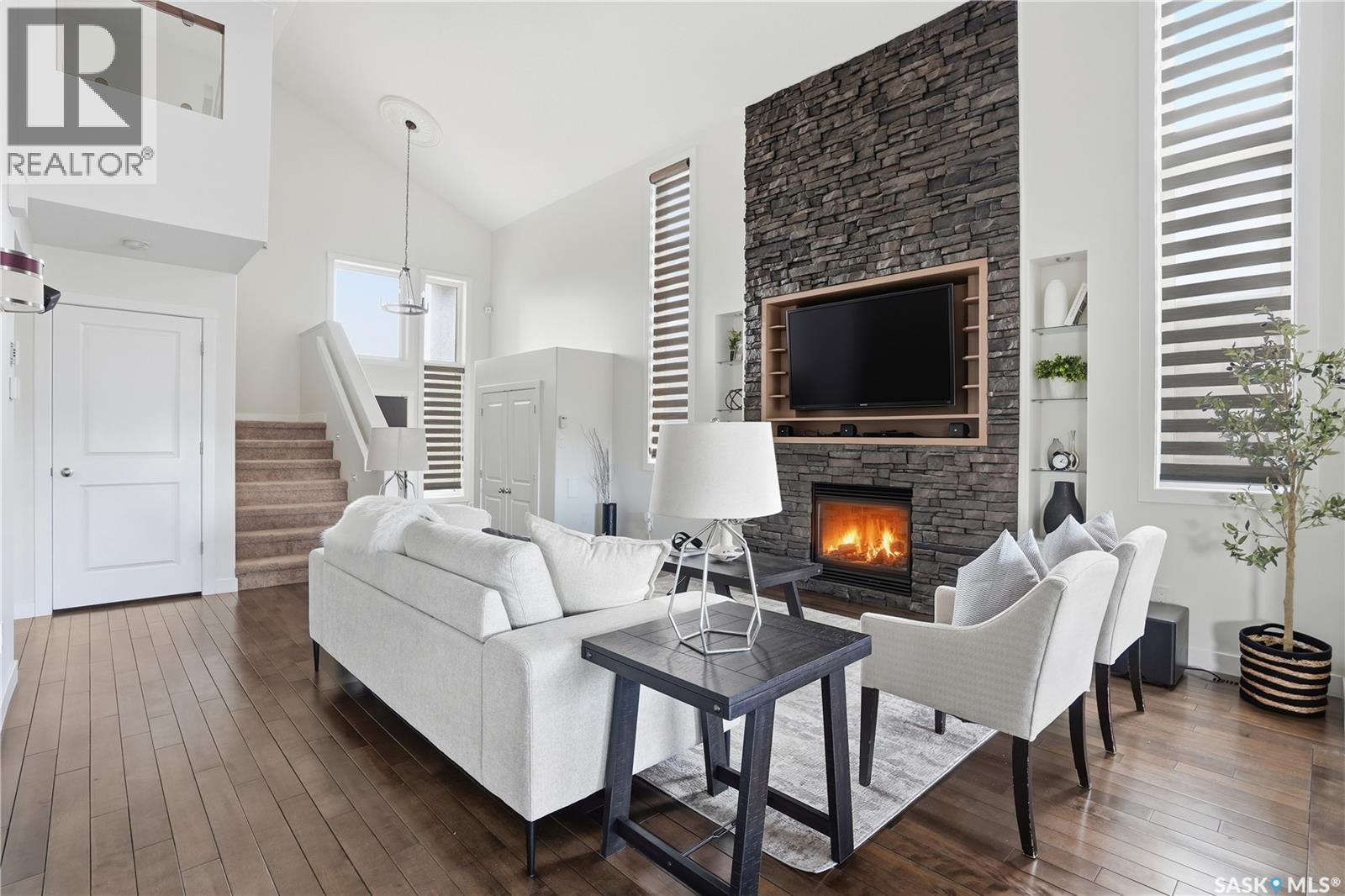 4128 Green Willow Terrace E, Regina, SK - Indoor Photo Showing Living Room With Fireplace