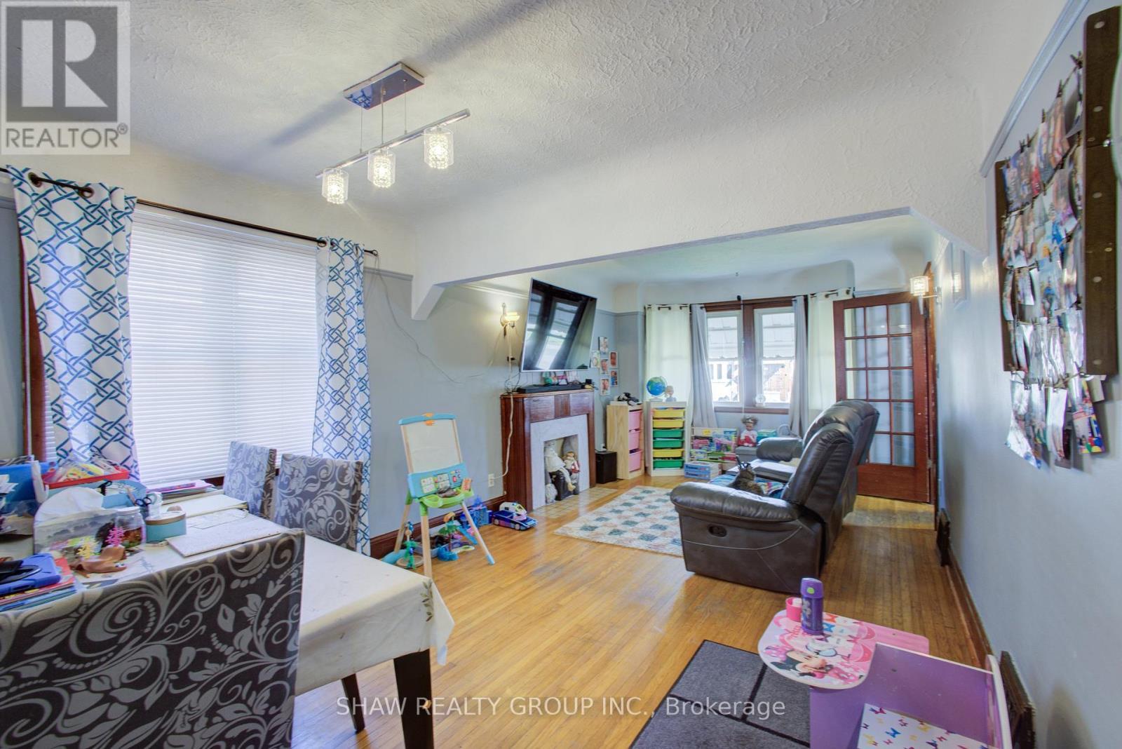 34 Barons Avenue S, Hamilton, ON - Indoor Photo Showing Other Room With Fireplace