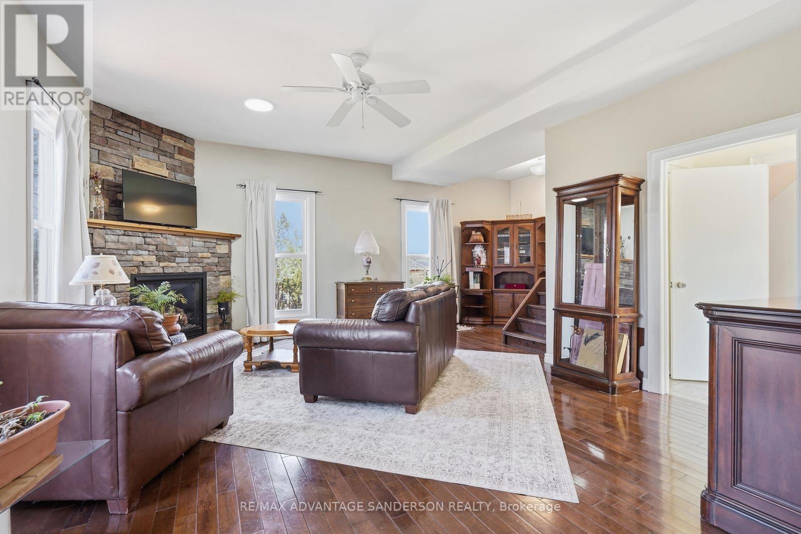 22476 Coldstream Road, Middlesex Centre, ON - Indoor Photo Showing Living Room With Fireplace