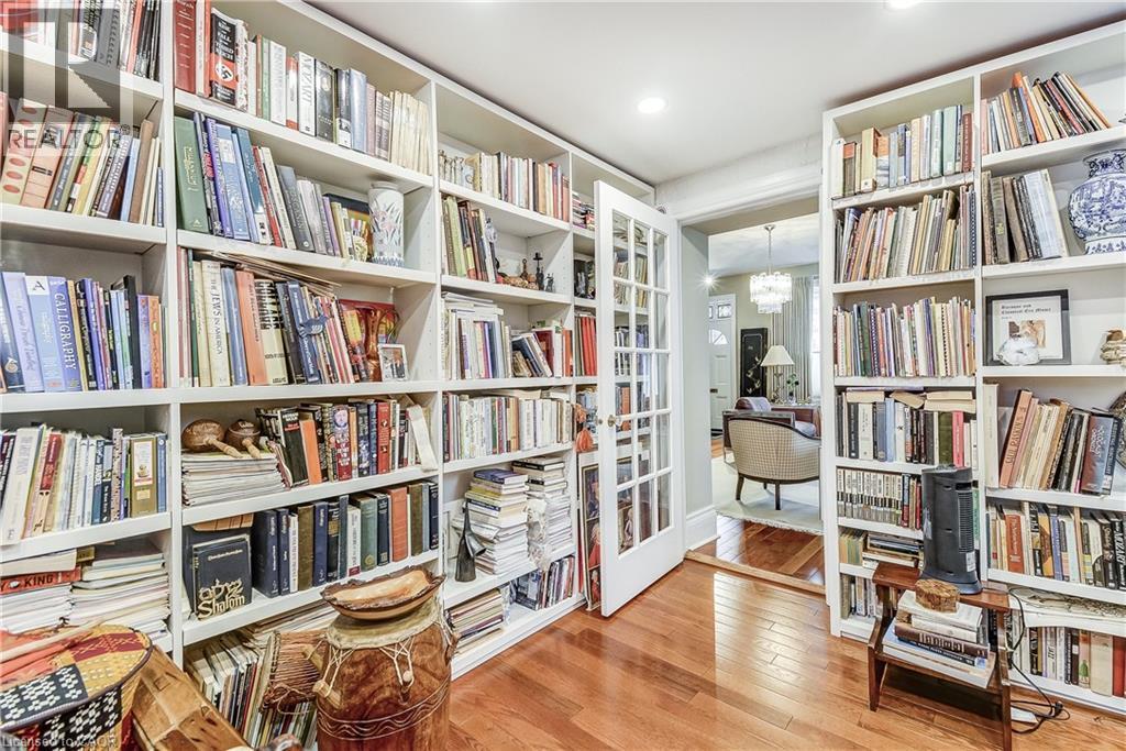Sitting room featuring light wood-style floors and wall of books - 315 Aberdeen Avenue, Hamilton, ON - Indoor