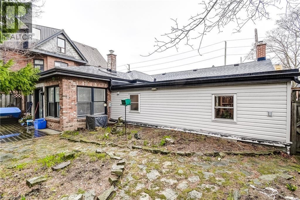 Rear view of property featuring a chimney and brick siding - 315 Aberdeen Avenue, Hamilton, ON - Outdoor