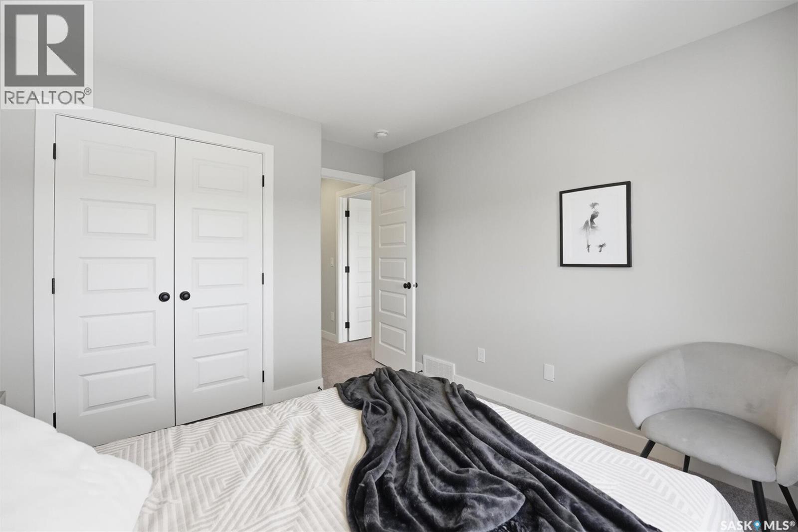 242 Kostiuk Crescent, Saskatoon, SK - Indoor Photo Showing Bedroom