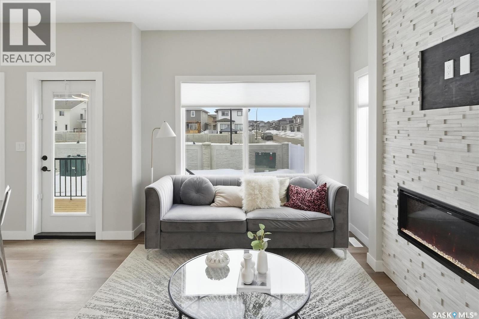 242 Kostiuk Crescent, Saskatoon, SK - Indoor Photo Showing Living Room With Fireplace
