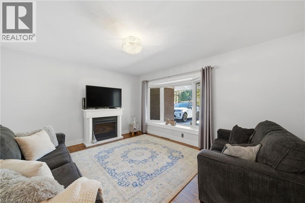 6 Summit Circle, Simcoe, ON - Indoor Photo Showing Living Room With Fireplace