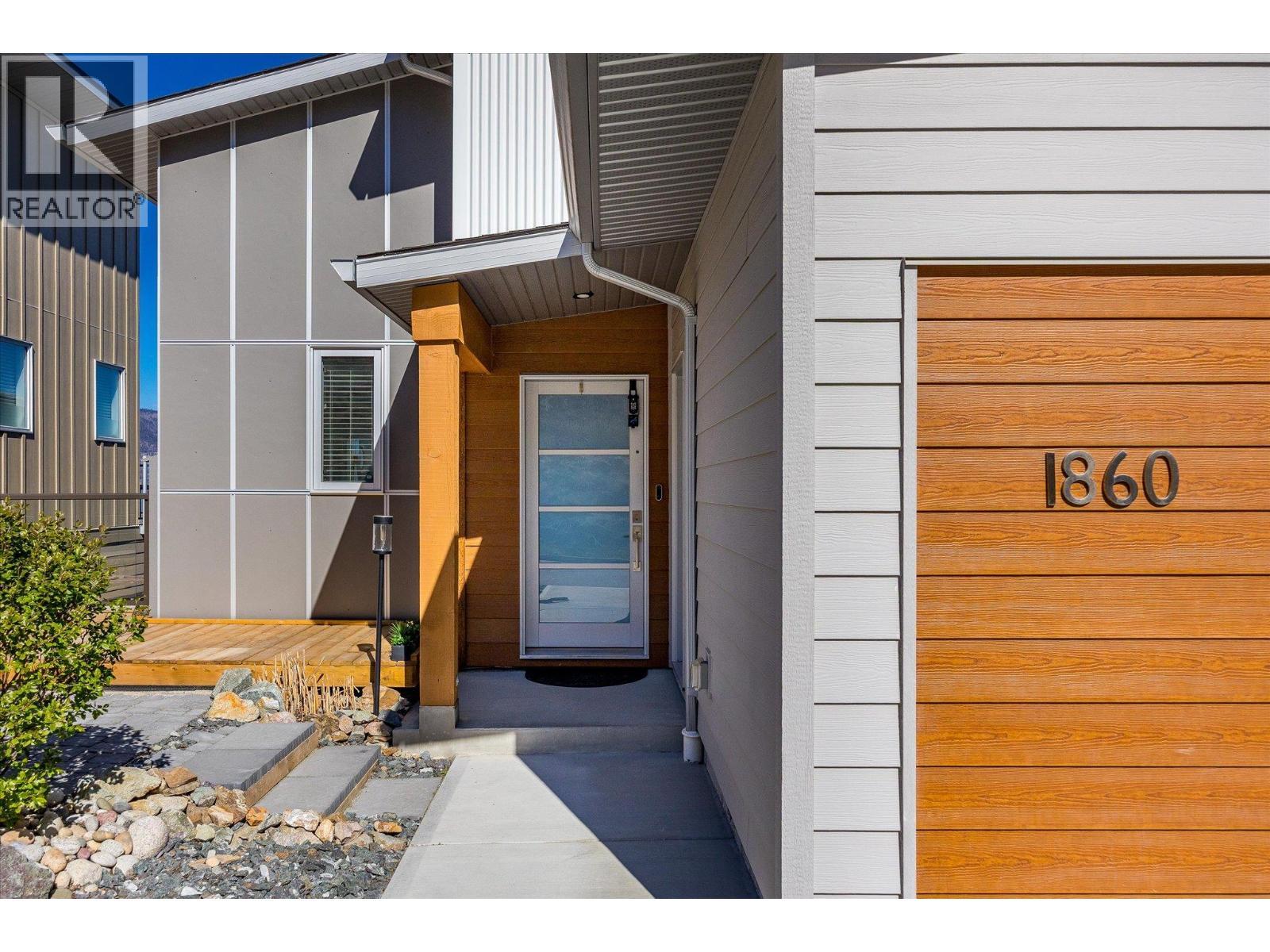 This entry way welcomes you home - 1860 Blue Bunch Court, Kelowna, BC - Outdoor With Exterior