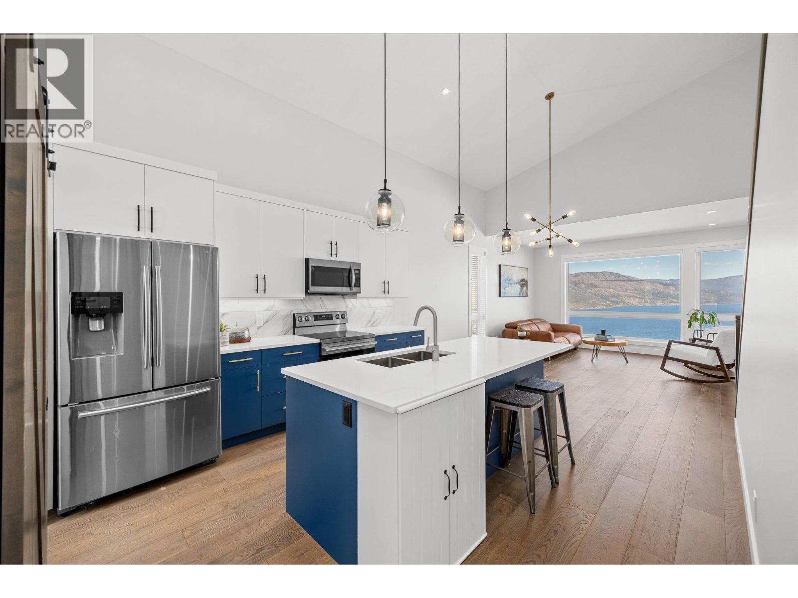 Large, bright, open living with gorgeous views! - 1860 Blue Bunch Court, Kelowna, BC - Indoor Photo Showing Kitchen With Upgraded Kitchen