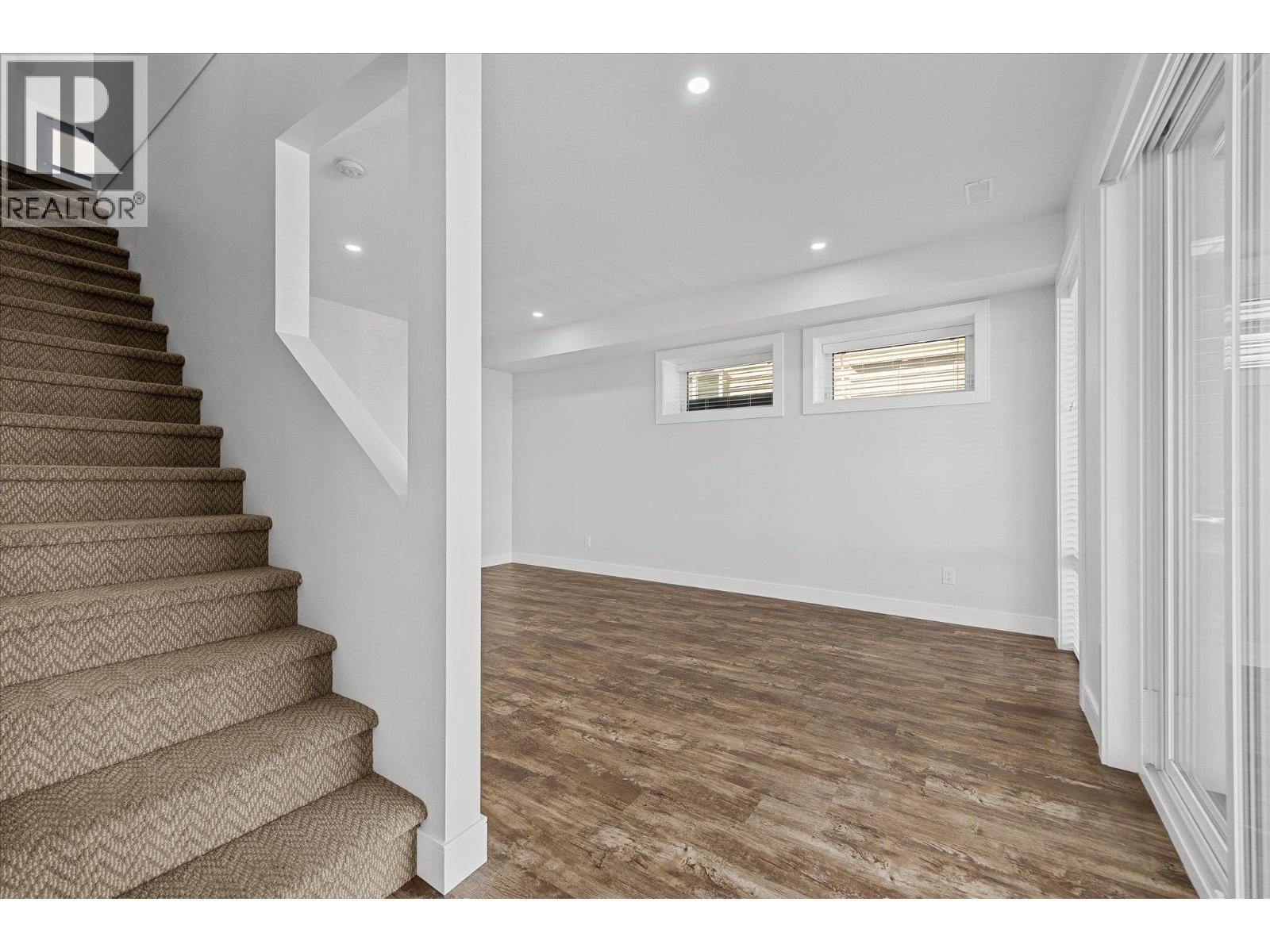 Stairs to the basement - 1860 Blue Bunch Court, Kelowna, BC - Indoor Photo Showing Other Room