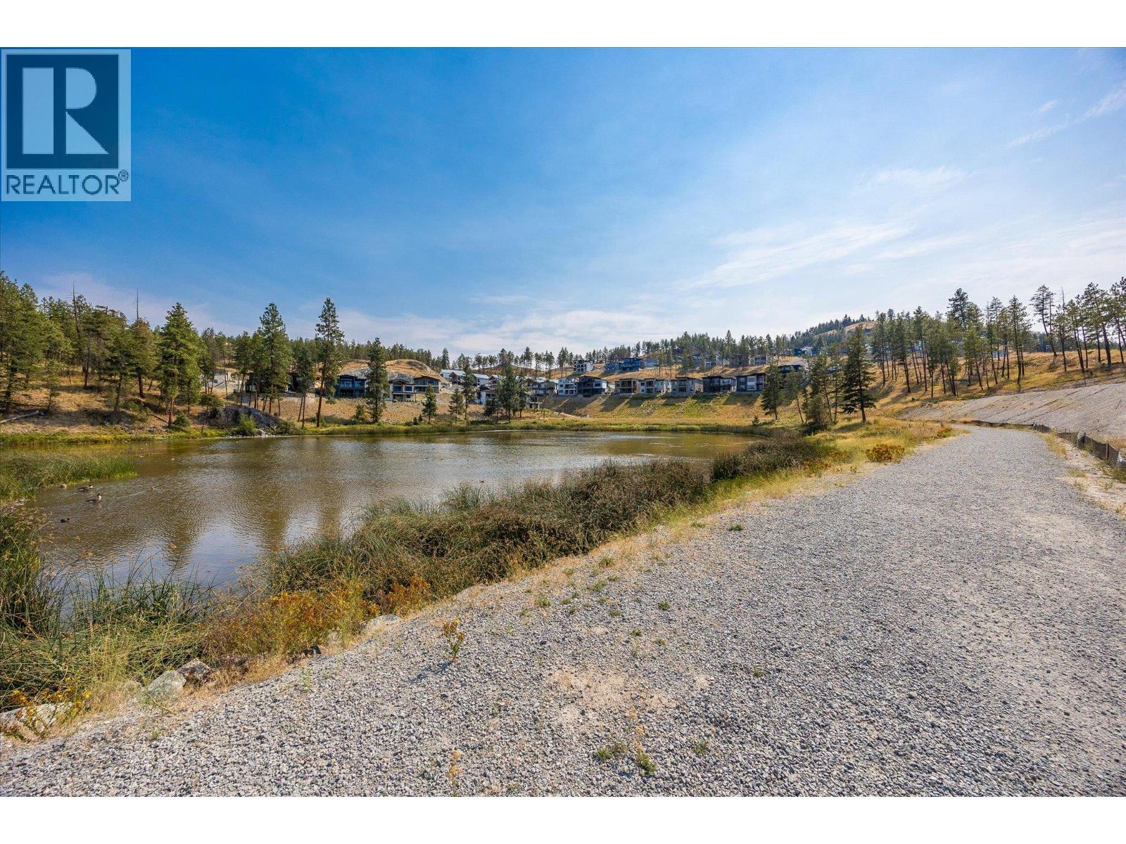 Lots of walking tails - 1860 Blue Bunch Court, Kelowna, BC - Outdoor With Body Of Water With View
