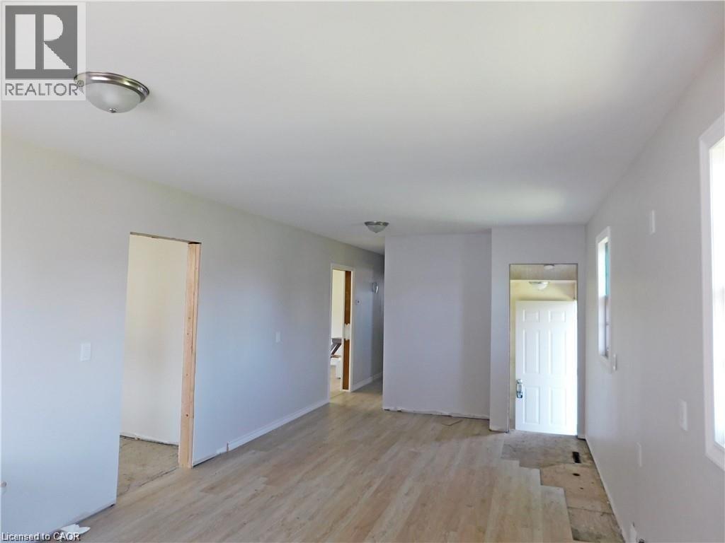 Spare room featuring light wood-style flooring and baseboards - 2474 Highway 24, Simcoe, ON
