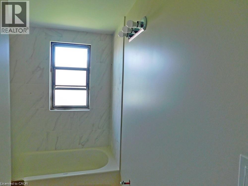Full bathroom featuring shower / bath combination - 2474 Highway 24, Simcoe, ON
