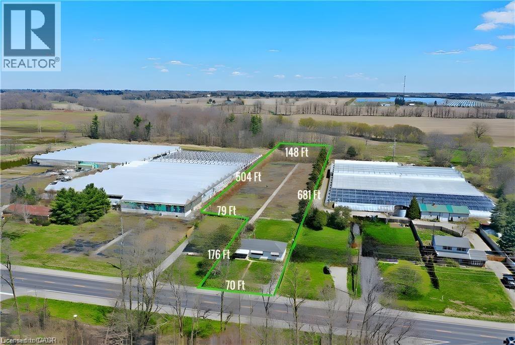 Aerial overview of property's location with property boundaries highlighted - 2474 Highway 24, Simcoe, ON