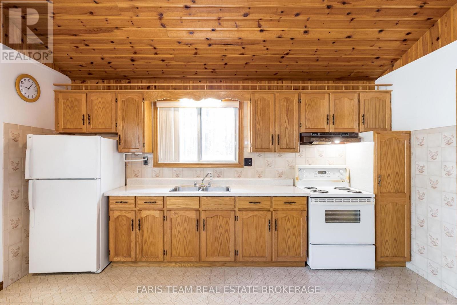 39 Rosemary Road, Tiny, ON - Indoor Photo Showing Kitchen With Double Sink