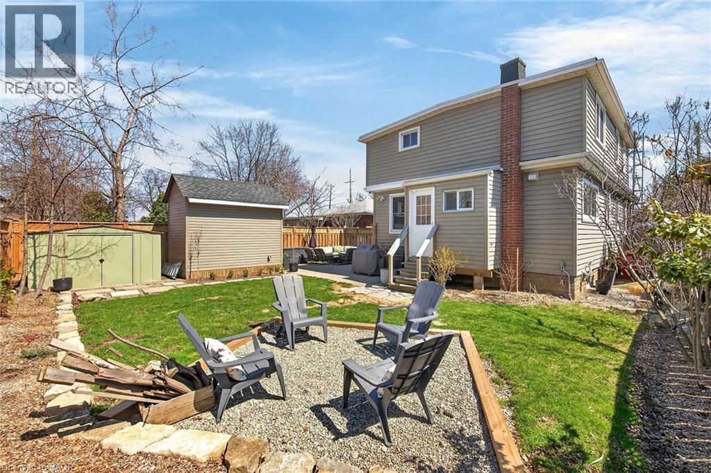 Fenced backyard featuring an outdoor living space, a patio area, and a gate - 844 Upper Wellington Street, Hamilton, ON - Outdoor