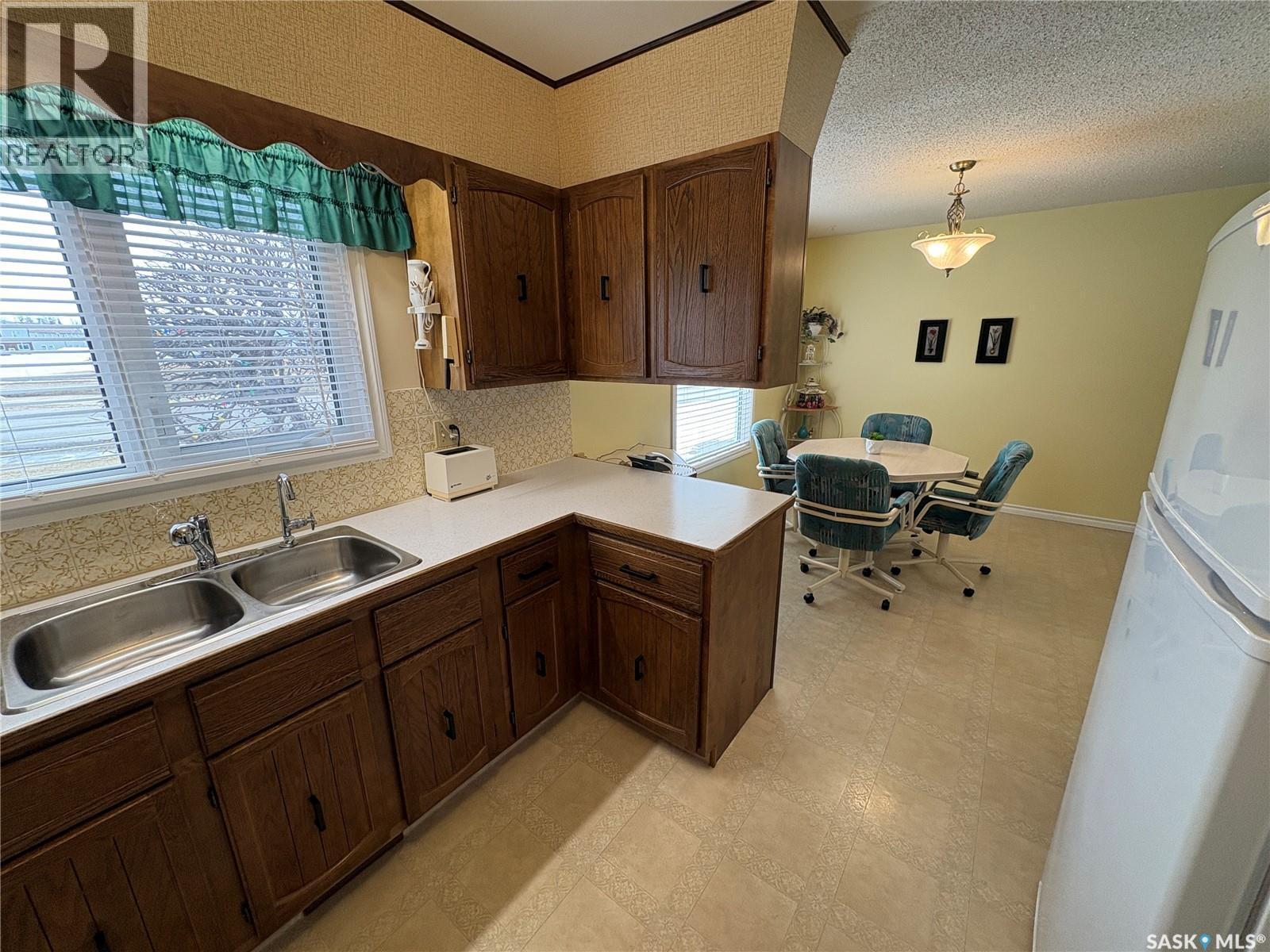 109 Road Avenue, Langenburg, SK - Indoor Photo Showing Kitchen With Double Sink
