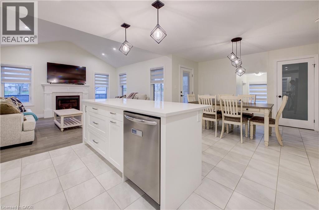 4 Livingston Drive, Tillsonburg, ON - Indoor Photo Showing Dining Room With Fireplace