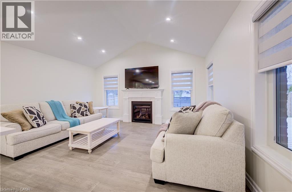 Cathedral Ceiling and LED Pot Lights - 4 Livingston Drive, Tillsonburg, ON - Indoor Photo Showing Living Room With Fireplace