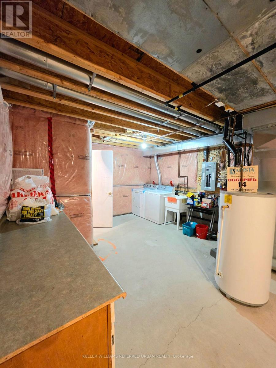 Laundry room with folding table - 129 Dolce Crescent, Vaughan, ON - Indoor Photo Showing Basement