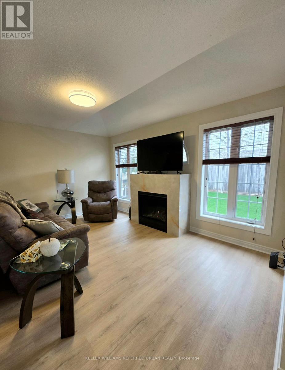 Lookout to the back yard - 129 Dolce Crescent, Vaughan, ON - Indoor Photo Showing Living Room With Fireplace