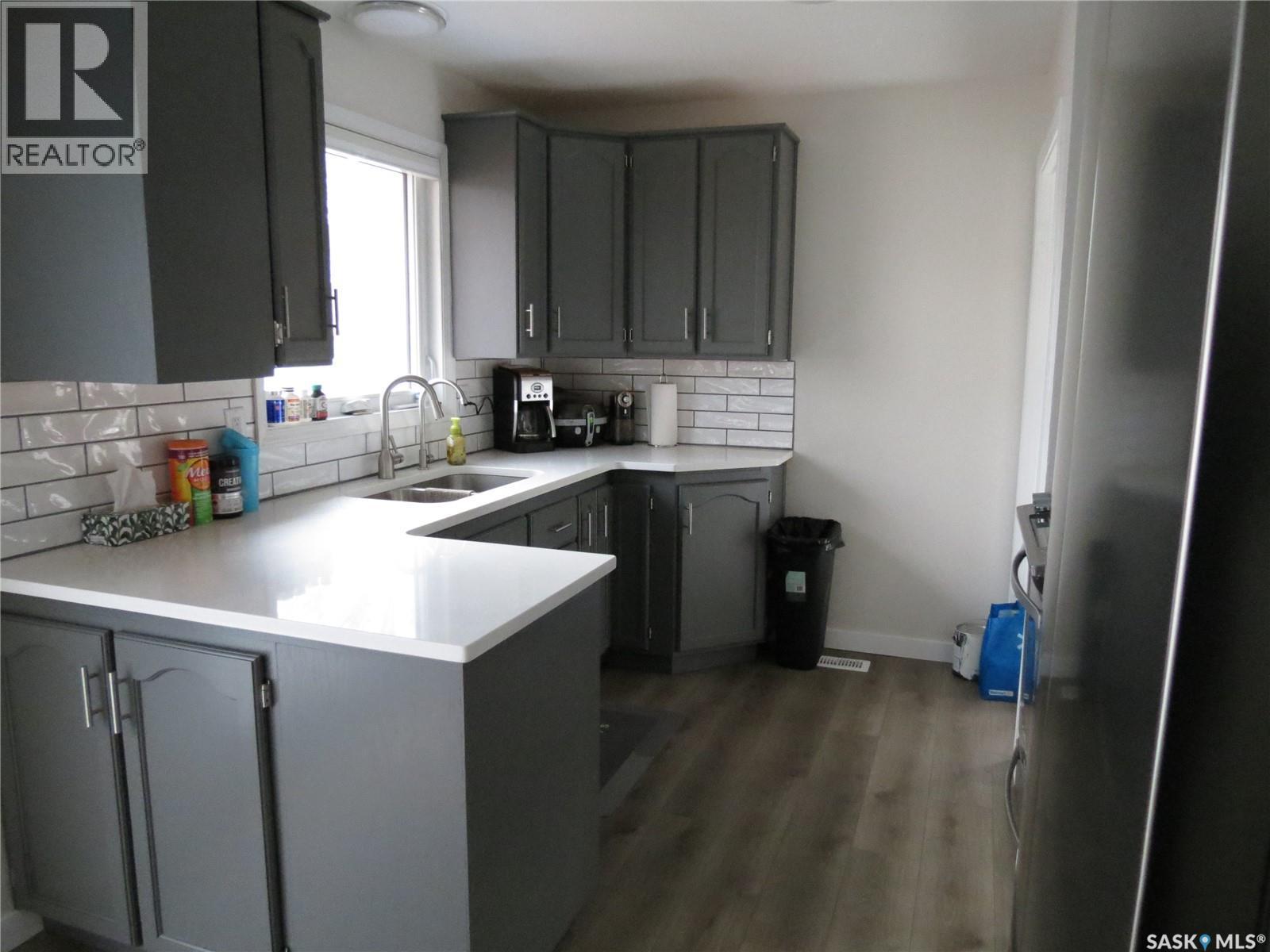 19 Merlin Crescent, Regina, SK - Indoor Photo Showing Kitchen With Double Sink