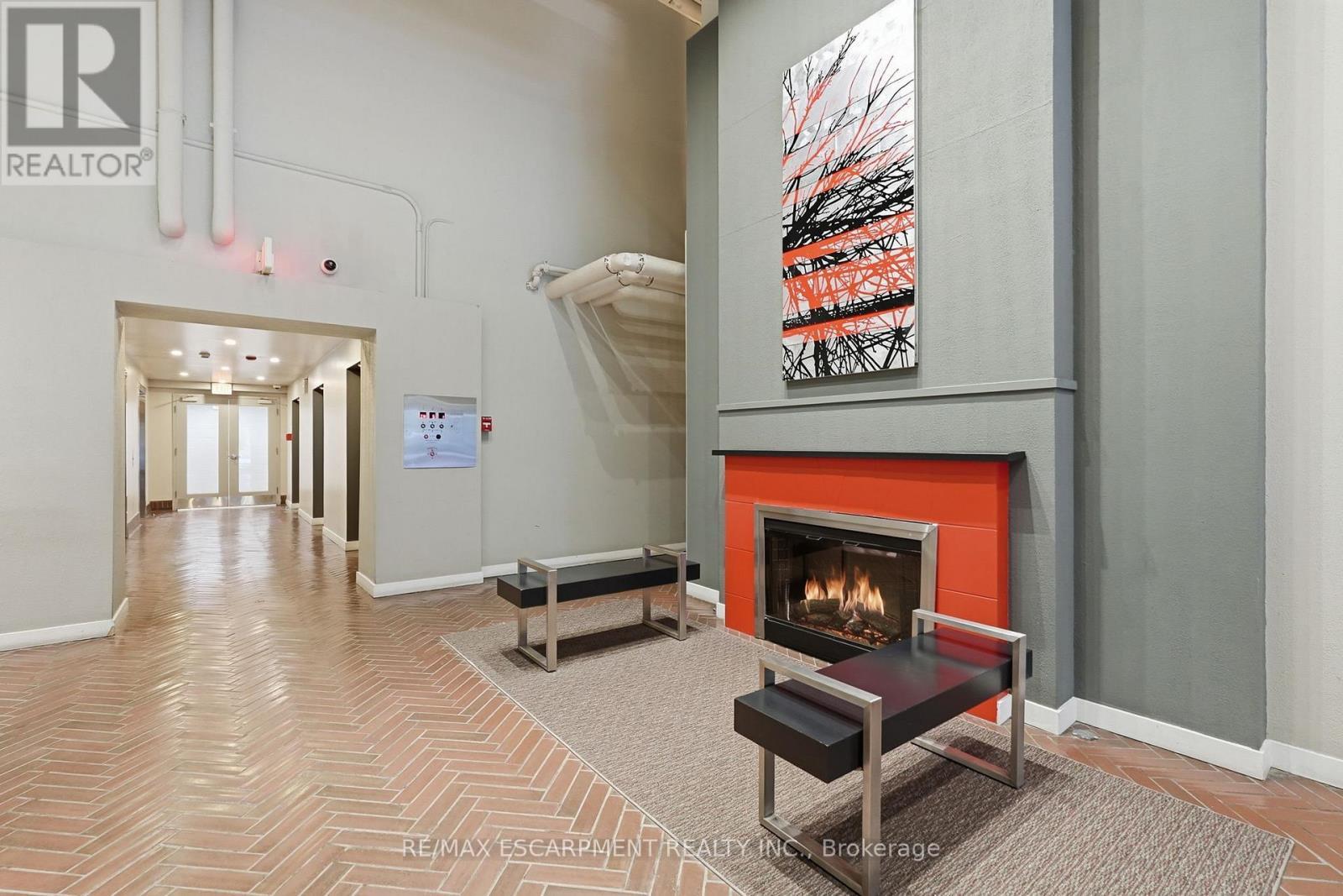 510 - 66 Bay Street S, Hamilton, ON - Indoor With Fireplace