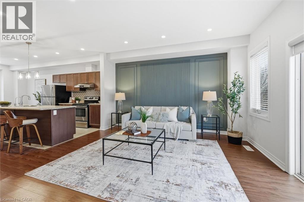 Feature accent wall provides built-in depth and style. - 122 E Dundas Street E Unit# 9, Waterdown, ON - Indoor Photo Showing Living Room