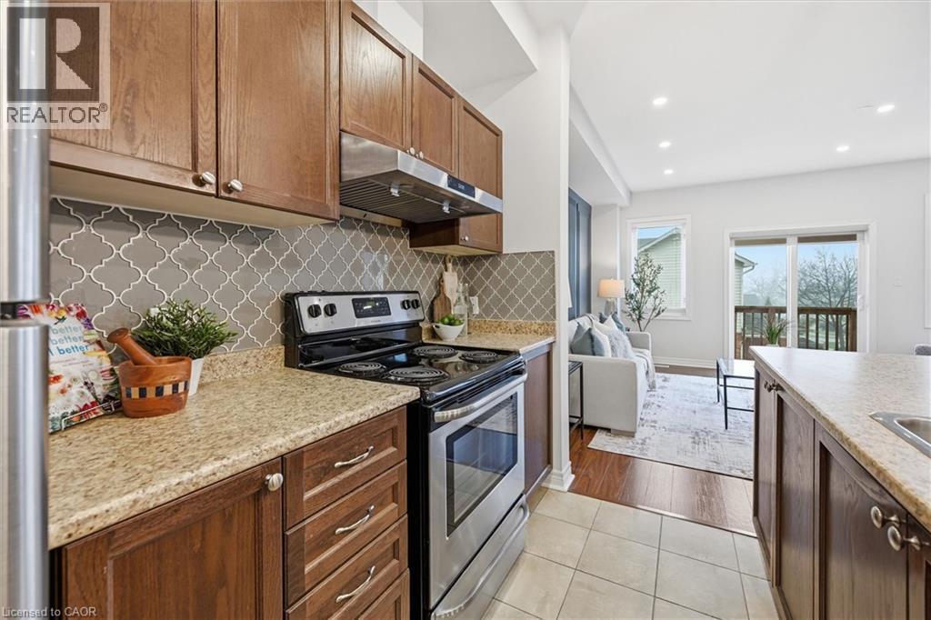 Stainless steel appliances, upgraded exhaust fan 1450 cfm. - 122 E Dundas Street E Unit# 9, Waterdown, ON - Indoor Photo Showing Kitchen