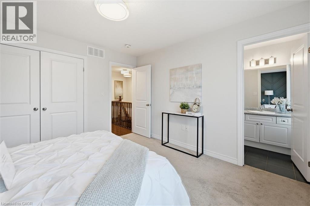 Primary bedroom featuring ensuite bath. - 122 E Dundas Street E Unit# 9, Waterdown, ON - Indoor Photo Showing Bedroom
