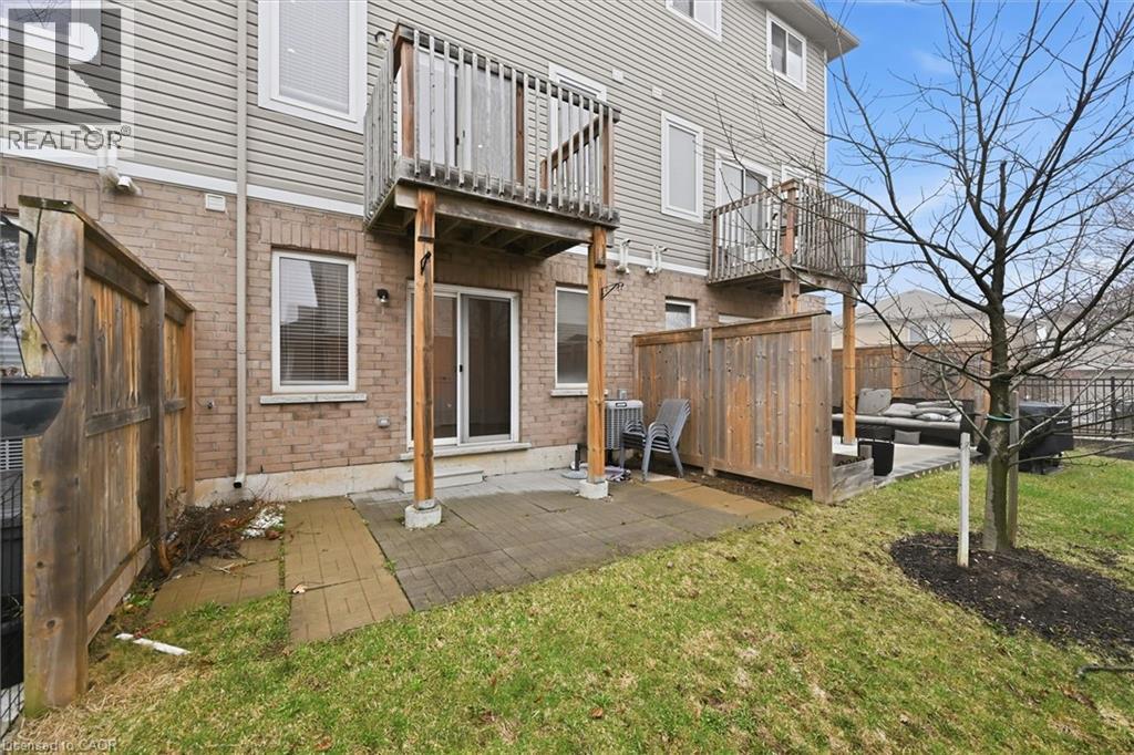 Back of property featuring a fenced backyard, a patio area, a balcony. - 122 E Dundas Street E Unit# 9, Waterdown, ON - Outdoor