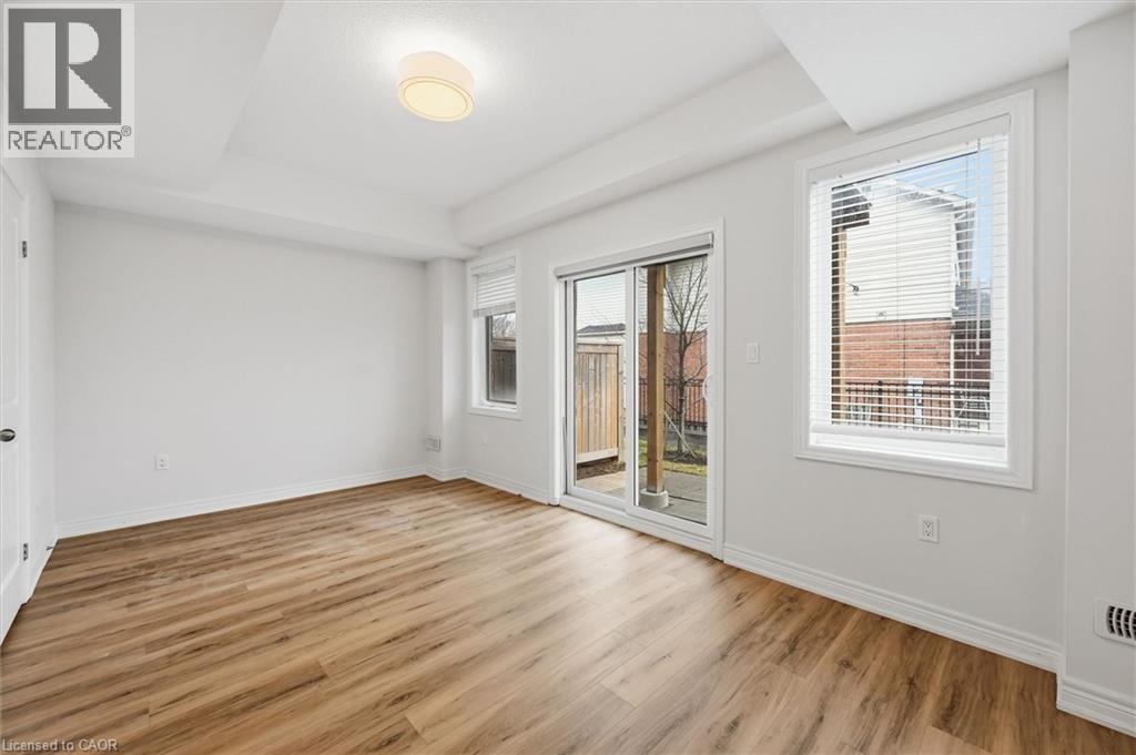Bright and spacious with Walk out to yard. - 122 E Dundas Street E Unit# 9, Waterdown, ON - Indoor Photo Showing Other Room