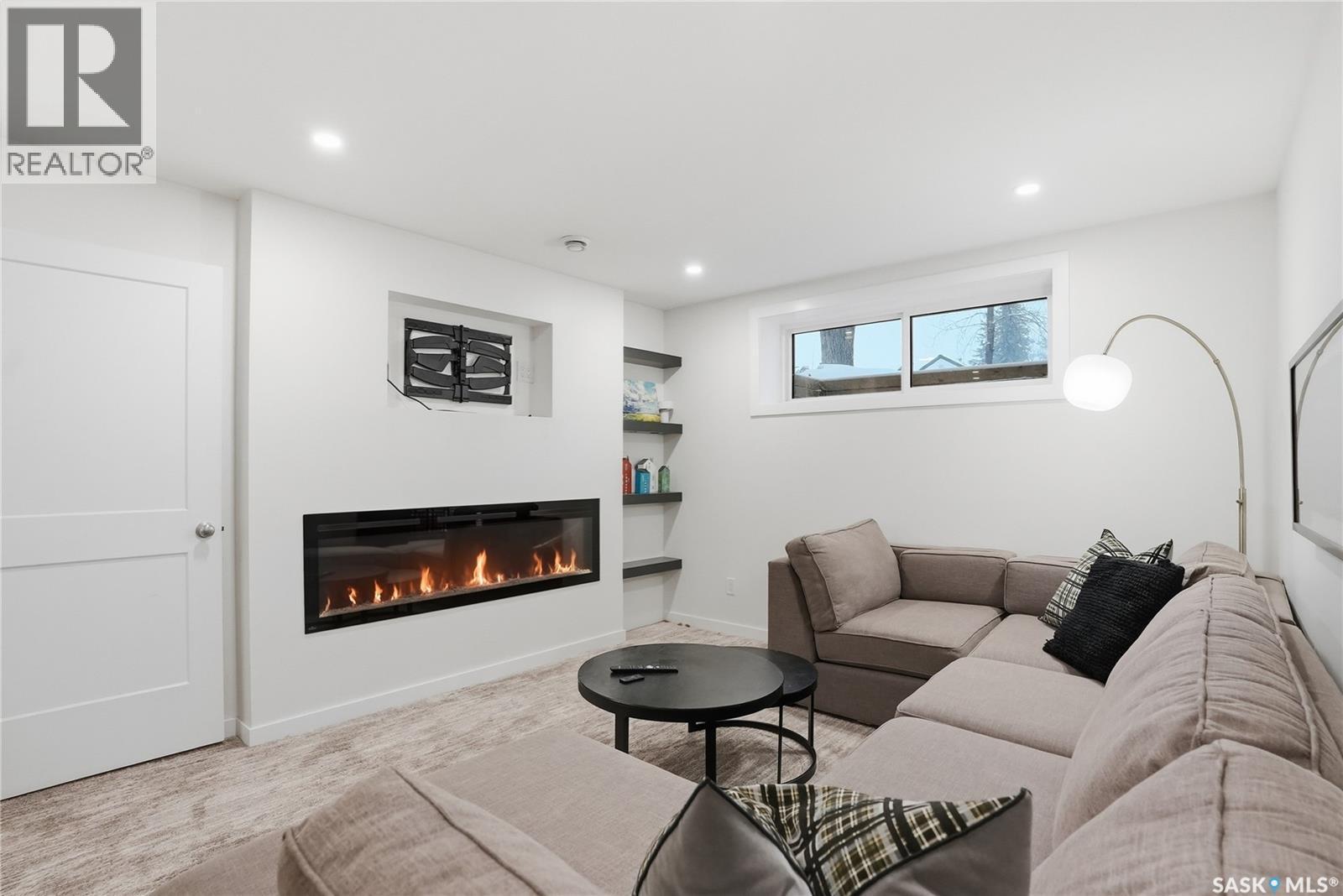 512 7Th Street E, Saskatoon, SK - Indoor Photo Showing Living Room With Fireplace