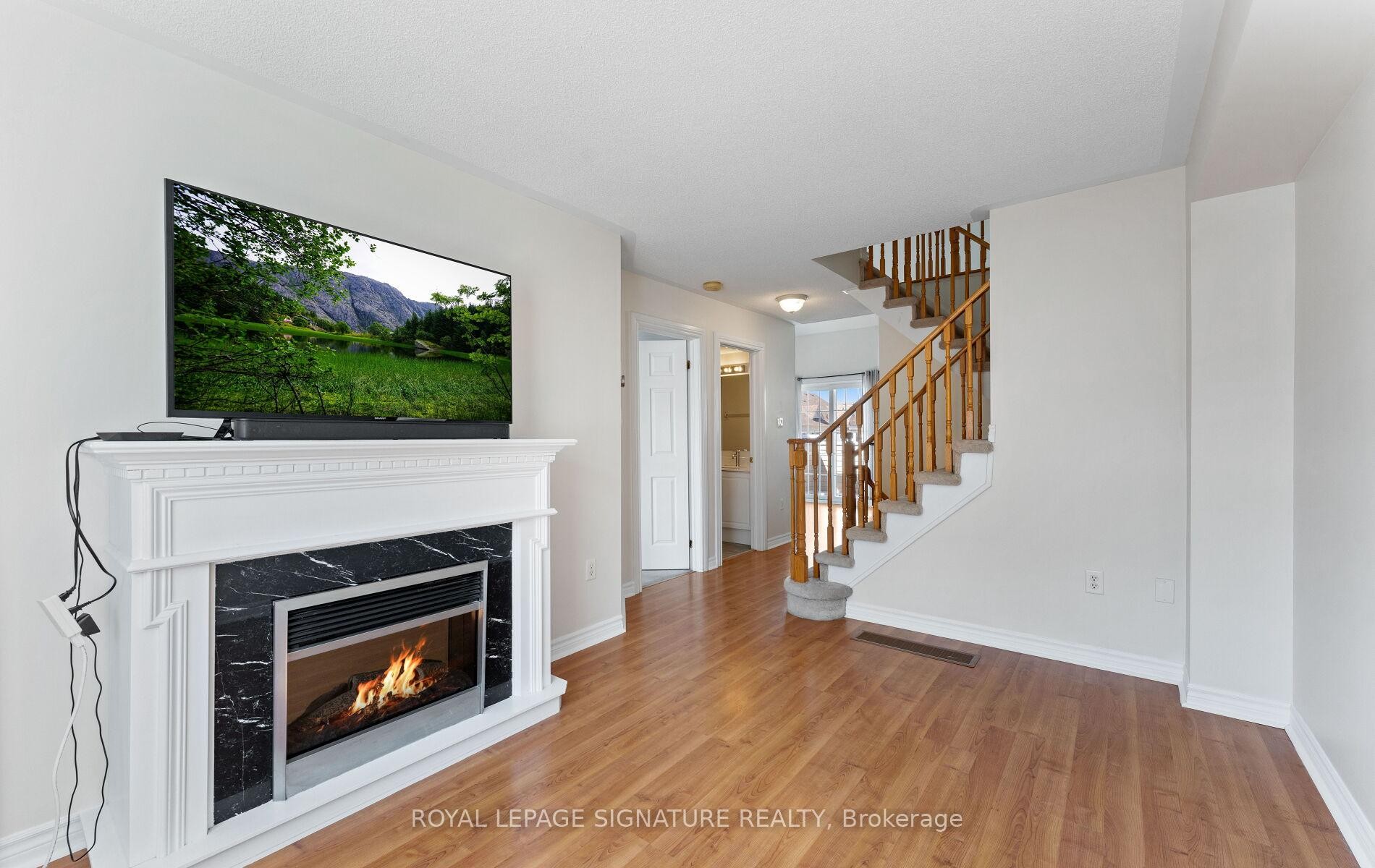 23 Yewtree Way, Whitby, ON - Indoor Photo Showing Living Room With Fireplace