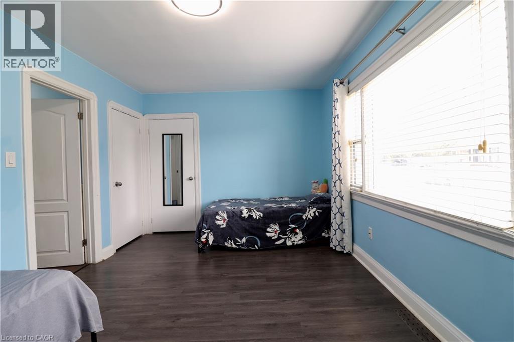 Bedroom with dark wood finished floors and a closet - 80 Roseview Avenue, Cambridge, ON - Indoor Photo Showing Bedroom