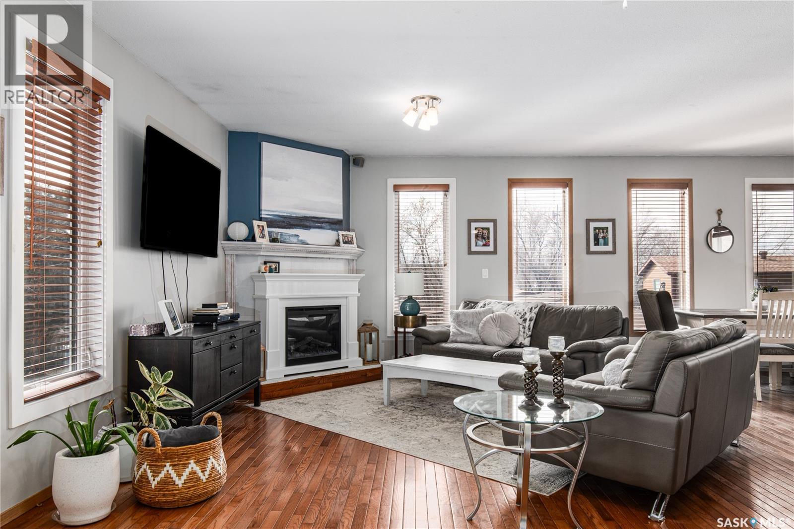 25 Alice Crescent, North Grove, SK - Indoor Photo Showing Living Room With Fireplace