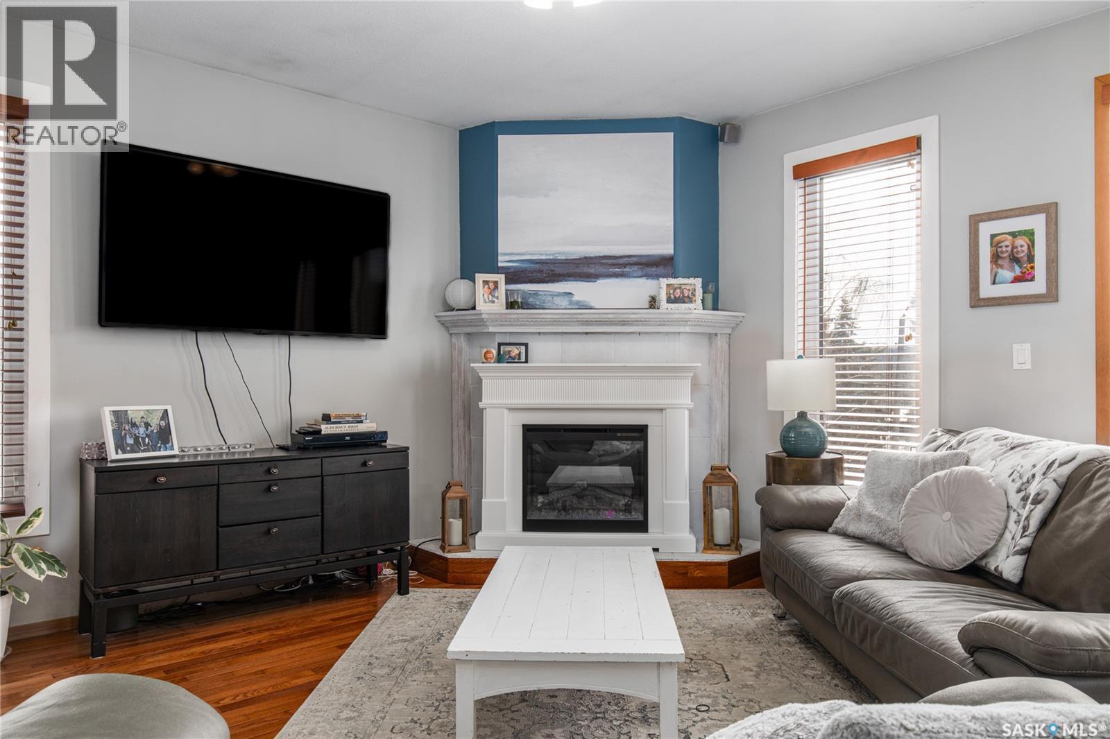 25 Alice Crescent, North Grove, SK - Indoor Photo Showing Living Room With Fireplace