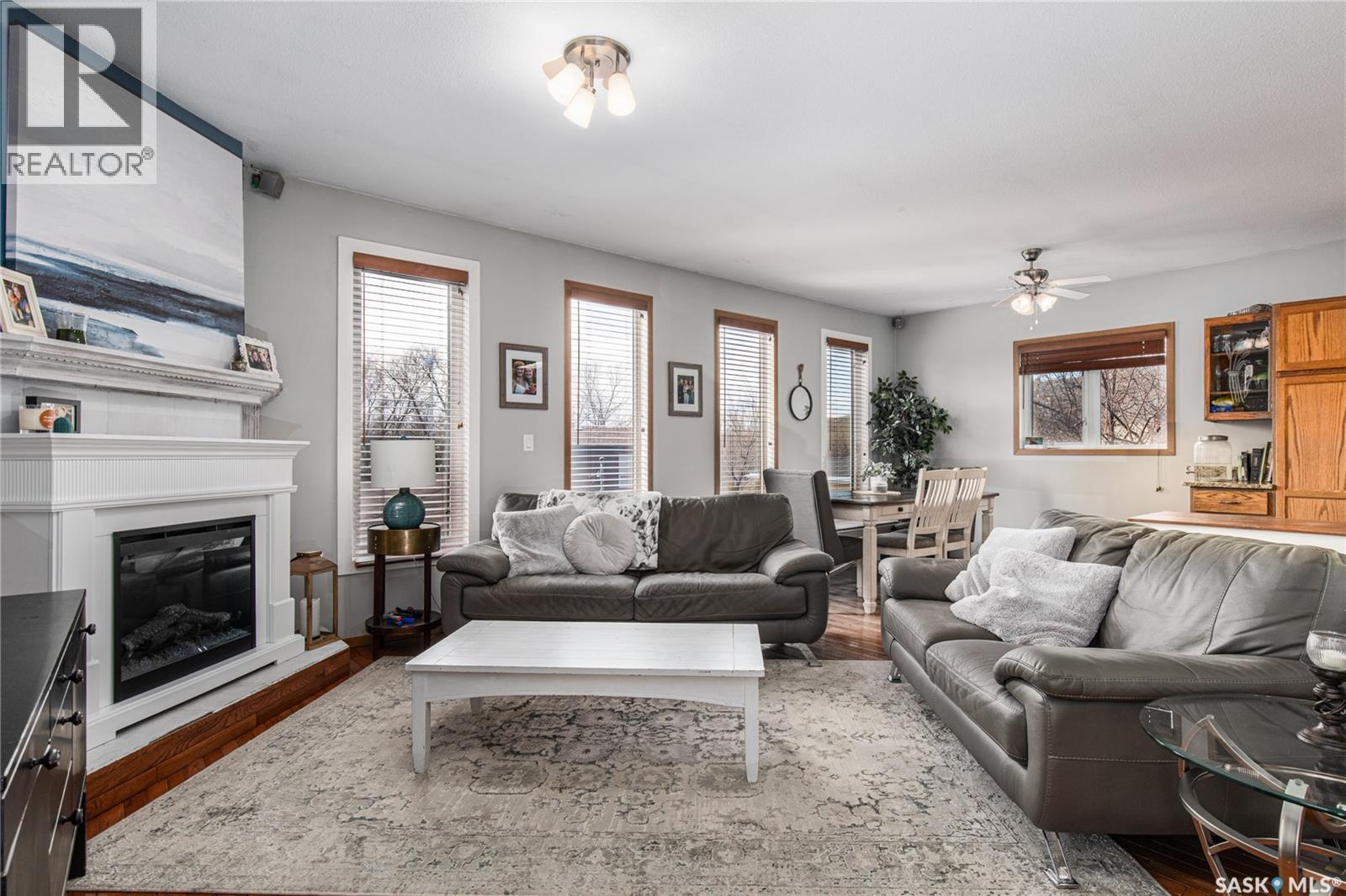 25 Alice Crescent, North Grove, SK - Indoor Photo Showing Living Room With Fireplace